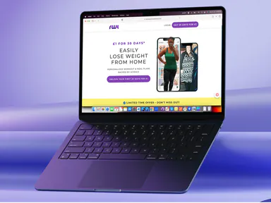 The Results Wellness Lifestyle home page on a laptop, advertising home workout programmes